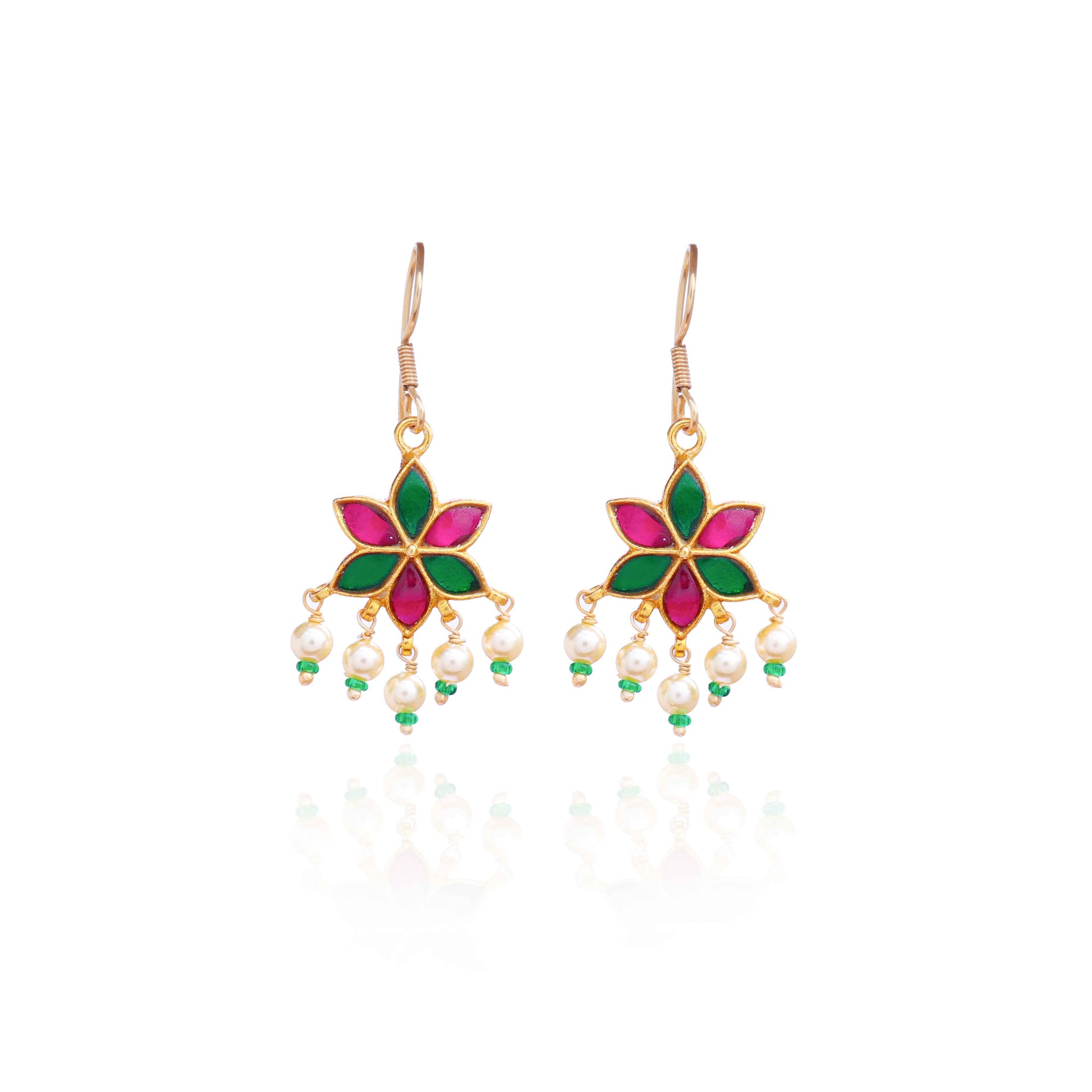 A gold-plated floral drop earring with pink and green enamel petals, featuring dangling freshwater pearls and green bead accents, worn by a model.