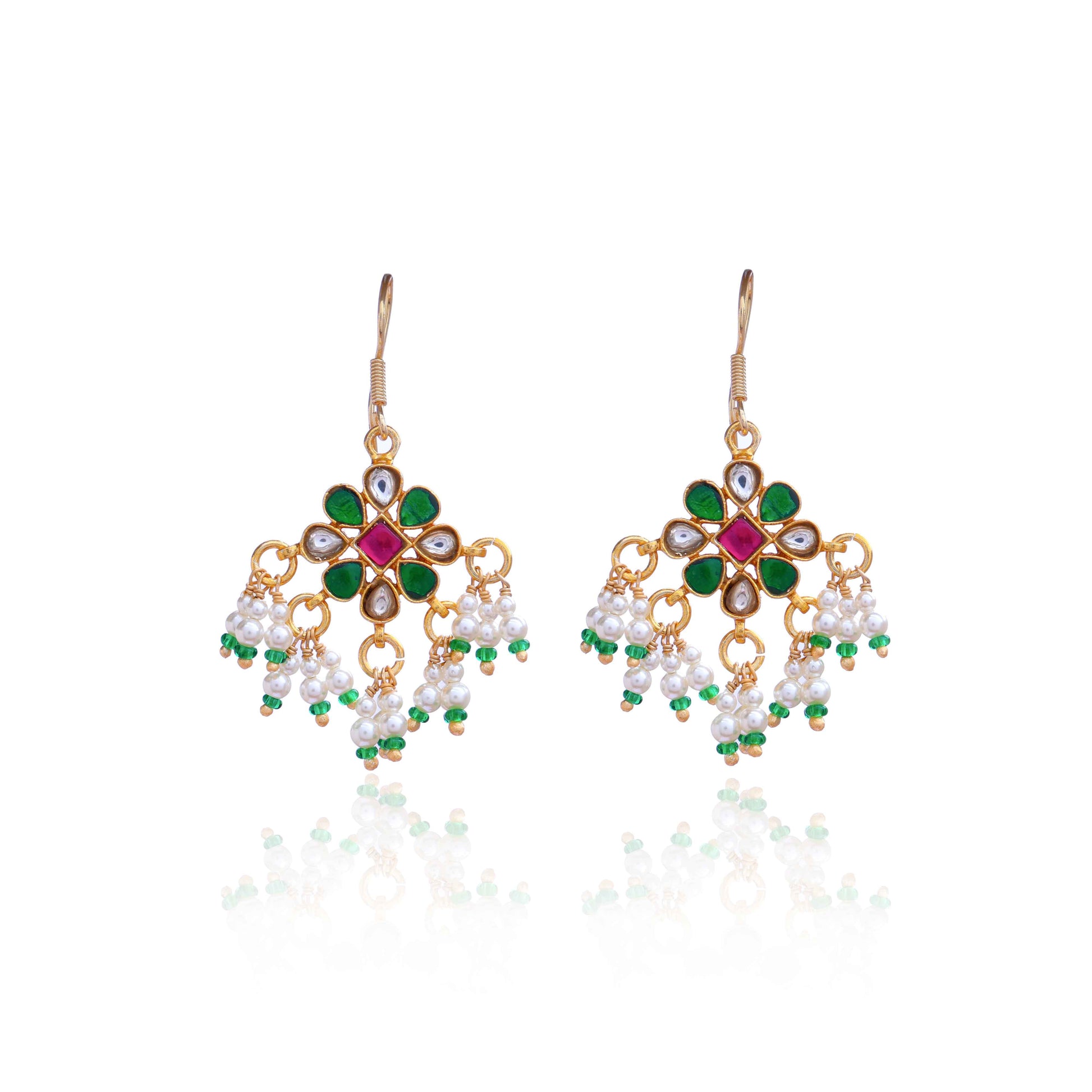 Gold-plated Kundan earrings with a floral motif, pink, green, and white gemstones, and dangling pearl clusters, worn by a model.