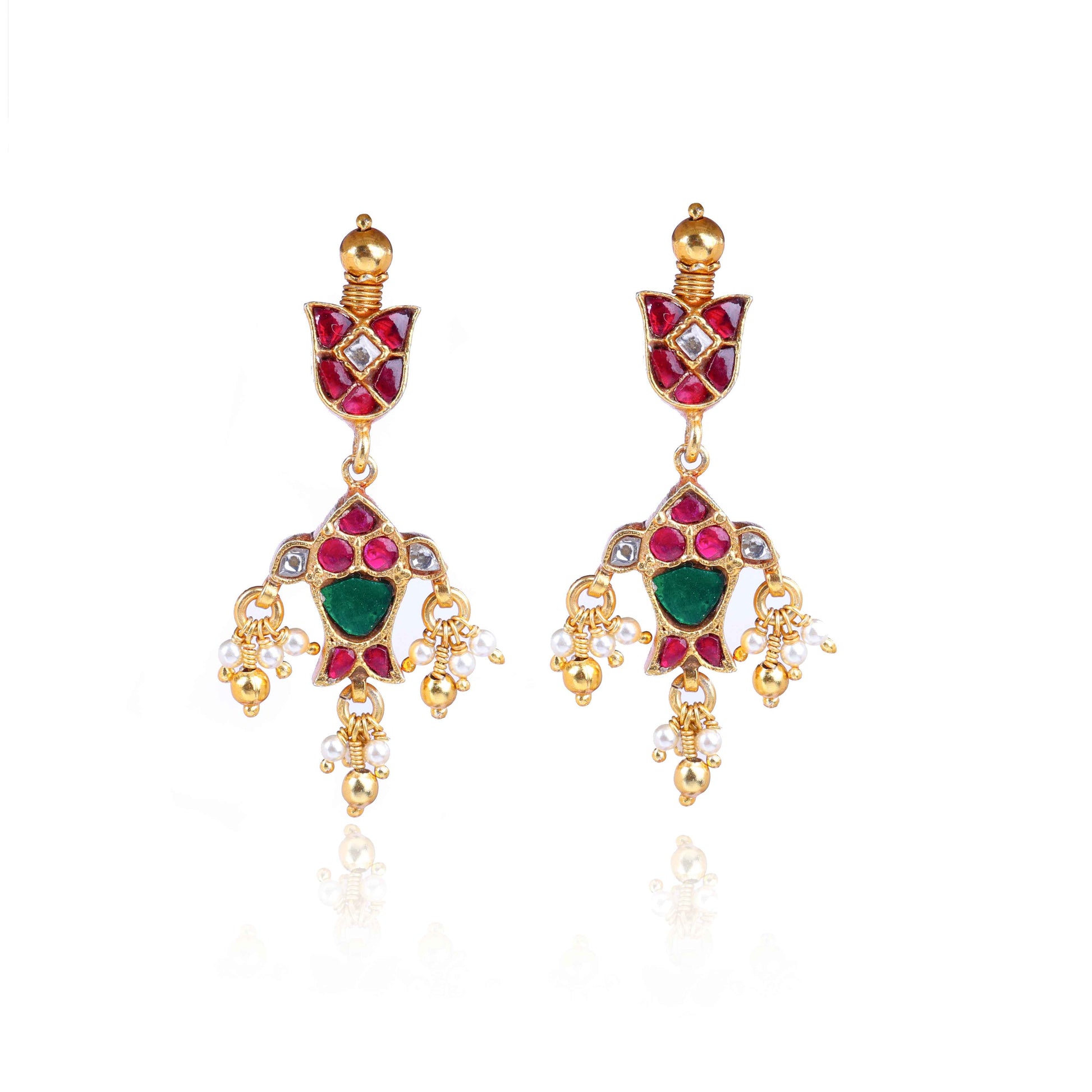 Gold-plated Kundan earrings with red and green gemstones, intricate floral design, and dangling pearl drops, perfect for traditional and festive wear.