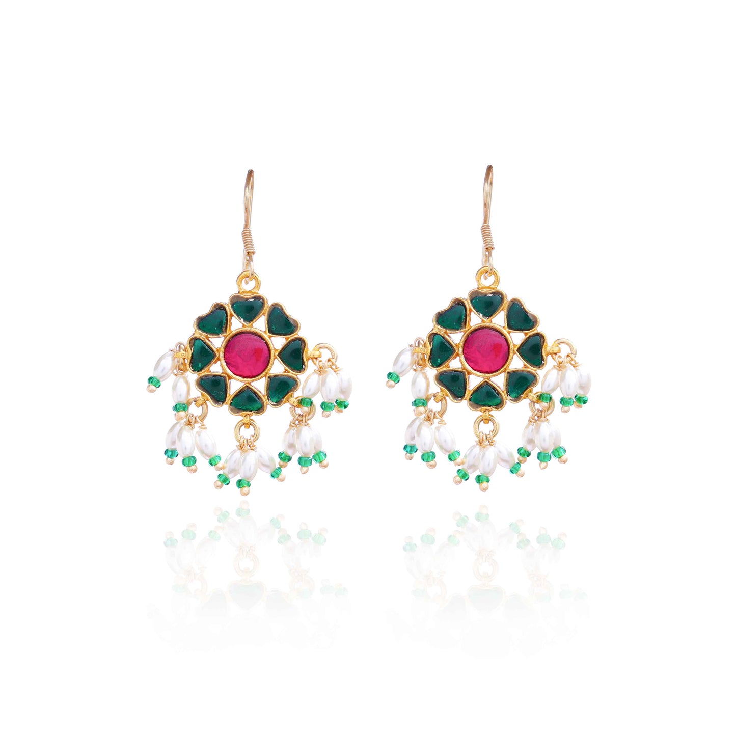 A gold-plated floral Kundan earring with a ruby-red center stone, deep green enamel petals, and dangling freshwater pearls, worn by a model with elegant styling.
